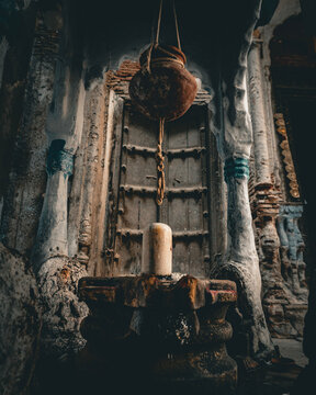 Shivling in front of an old door