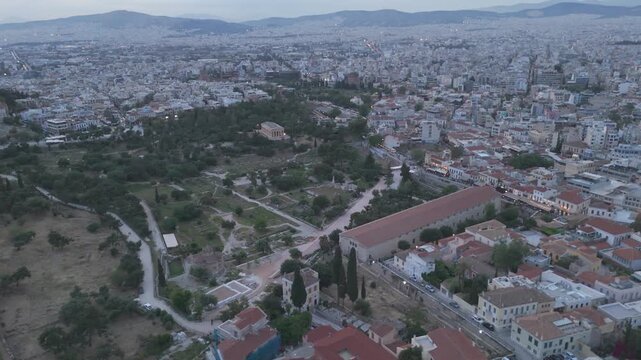 Aerial - Ancient Agora Temple of Hephaestus and Stoa of Attalos over Athens at twilight, Greece