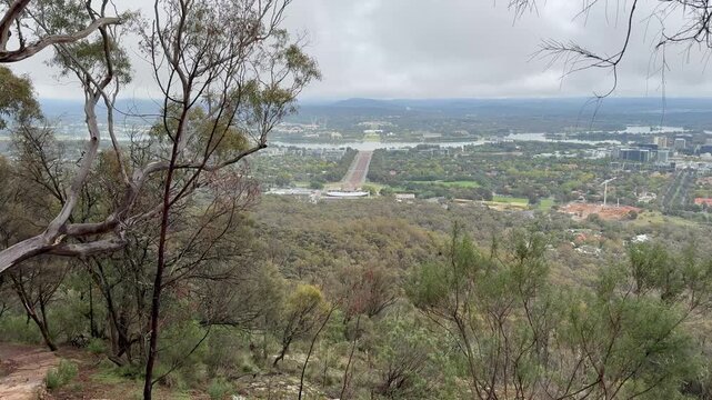 A panoramic view from the famous Mount Ainslie Lookout over Canberra, with Anzac Parade's long, runway-like axis leading to Parliament House, Australian Capital Territory, Australia.