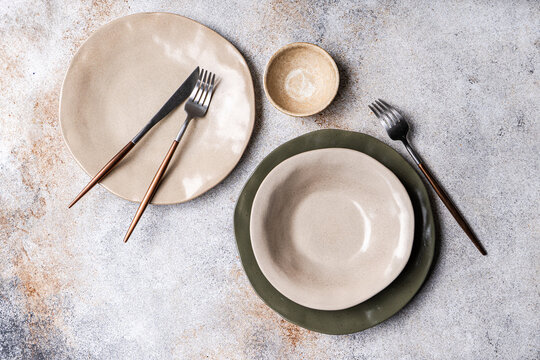 Rustic ceramic table set with plate bowl and cutlery
