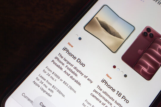Quetzaltenango, GUATEMALA - Sep 9 2026 : Smartphone showing Apple's iPhone lineup page, with the new iPhone Duo listed from $1,999 beside the new iPhone 18 Pro shown in a dark red finish.