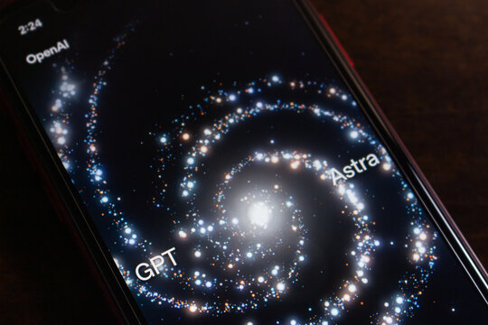 Quetzaltenango, GUATEMALA - Sep 9 2026 : Close-up of a smartphone showing OpenAI's GPT-6 Astra page, with a spiral galaxy image of blue and orange points and the words GPT and Astra set along its arms