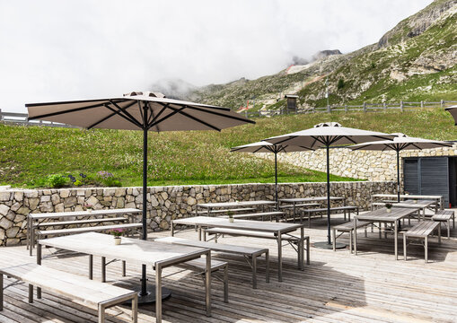 Mountain terrace beneath misty Dolomites in Corvara