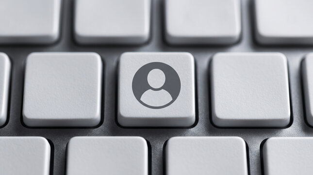 User profile icon on a computer keyboard key for digital account login and identity access.