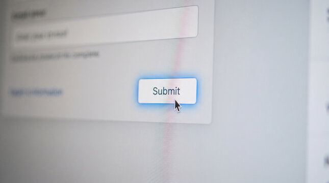 Computer mouse cursor clicking a submit button on a digital web form interface