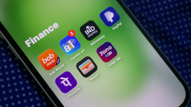 Finance applications folder on green screen smartphone featuring online banking and payment apps.