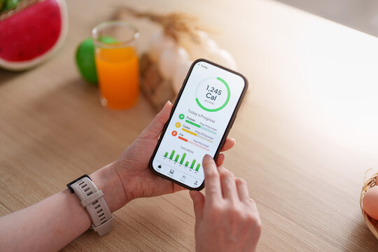 Person using smartphone calorie tracking app for daily nutrition and health management