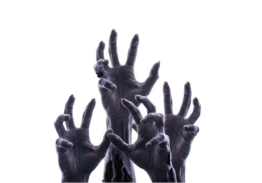 Scary black zombie hands reaching up in a dark and spooky halloween theme