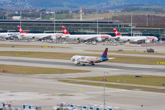 Brussels Airlines passenger airplane type Airbus A320-214 registration OO-SNM Atomium livery taking off from Swiss Z&uuml;rich Airport. Photo taken February 22nd, 2026, Zurich Airport, Switzerland.