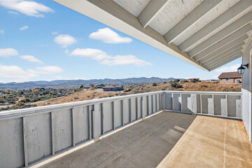 Obraz premium Balcony with distant hillside town view