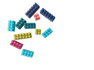 Childrens lego toys scattered on a clean white background © Nur Indah Maya S