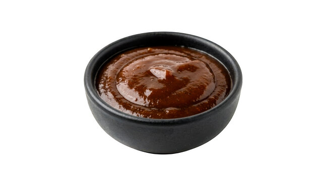 Small black bowl filled with delicious brown barbecue sauce isolated on transparent background