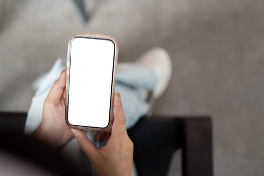 Overhead View Person Holding Smartphone With Empty White Display