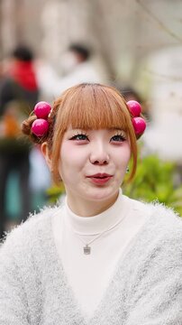 Young Japanese Woman with Harajuku Fashion Laughing Outdoors in Tokyo