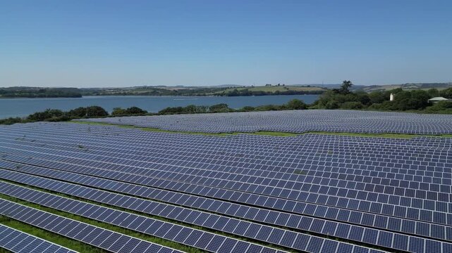 Plymouth, Devon, England: A solar panel farm, the River Tamar and a sewage farm on the edge of the city. Solar farms are a part of the UK government's strategy for achieving net zero by 2030.