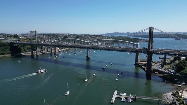 Saltash, Cornwall, England: DRONE VIEWS: The Tamar bridge (road) and the Royal Albert Bridge (rail) spanning the River Tamar. The River Tamar is the natural border which divides Devon and Cornwall.