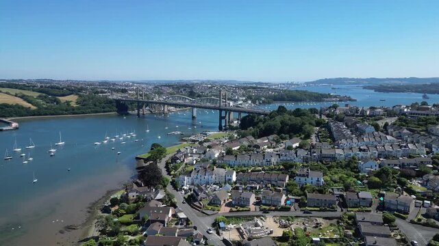 Saltash, Cornwall, England: DRONE VIEWS: The Tamar bridge (road) and the Royal Albert Bridge (rail) spanning the River Tamar. The River Tamar is the natural border which divides Devon and Cornwall.