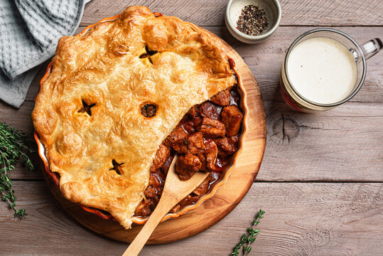 Beef steak pie with dark beer gravy and puff pastry crust