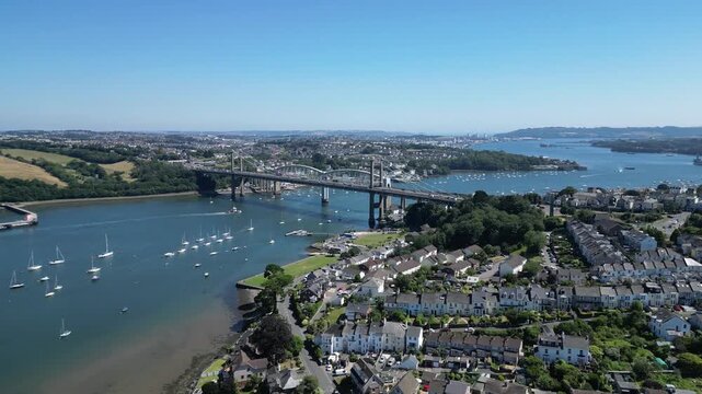 Saltash, Cornwall, England: DRONE VIEWS: The Tamar bridge (road) and the Royal Albert Bridge (rail) spanning the River Tamar. The River Tamar is the natural border which divides Devon and Cornwall.
