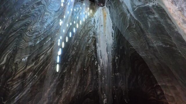 Towering Underground Salt Cavern Rising Like a Deep Vertical Shaft, Turda, Romania - TILT UP VIDEO - NO AUDIO