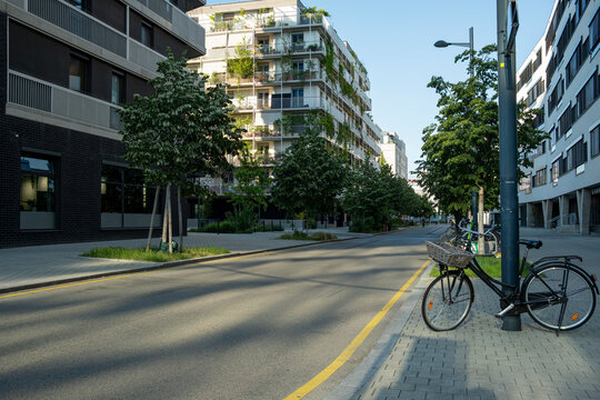 Quiet urban street with bicycle and modern residential architecture in Nordbahnviertel Vienna Austria showing everyday mobility in a contemporary neighborhood