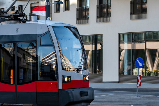 Modern tram passes contemporary architecture on an urban street in Nordbahnviertel Vienna Austria showing transport and building context in a growing district