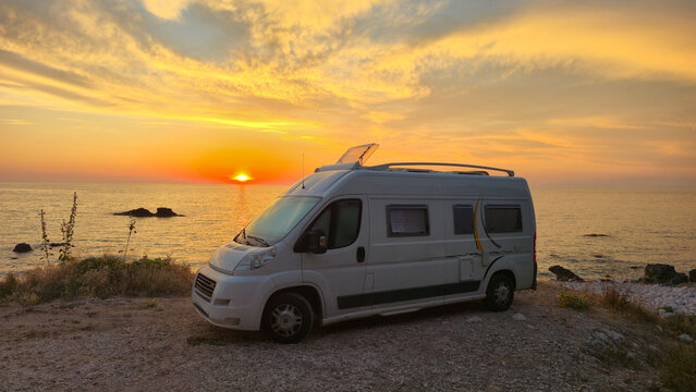 Sunset serenity at Tsoukalades beach Lefkada Greece with a charming camper van