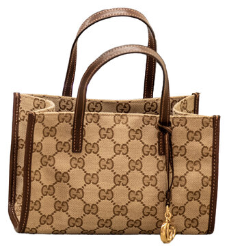 Small canvas shopping bag with GG pattern and golden pendant, by Gucci.Milan - Italy,10 September 2026