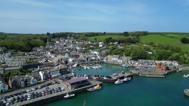 Padstow, Cornwall, England: DRONE VIEWS: The drone circles over the River Camel showing yachts, boats and trawlers moored inside Padstow harbour. The town of Padstow is renowned for its culinary links