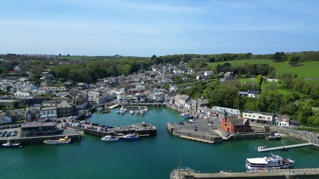 Padstow, Cornwall, England: DRONE VIEWS: The drone circles over the River Camel showing yachts, boats and trawlers moored inside Padstow harbour. The town of Padstow is renowned for its culinary links