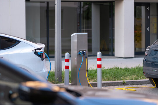 Electric cars use charging infrastructure at an urban station in Nordbahnviertel Vienna Austria showing modern mobility within a residential neighborhood