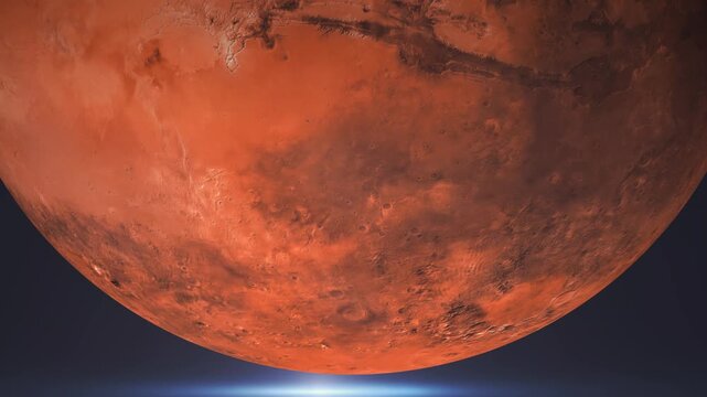 Close up view of planet Mars rotating in deep space with glowing horizon light.