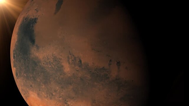 Planet Mars rotating in deep space with sun flare lighting the horizon
