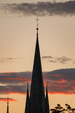 Spire of St Catherine church in Torun Poland at sunset