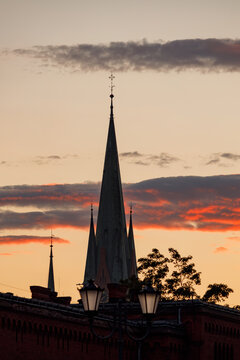 Spire of St Catherine church in Torun Poland at sunset