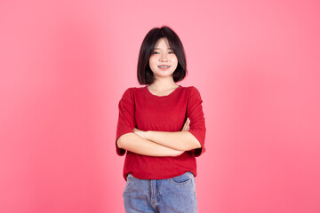 Obraz na płótnie Canvas Asian Thai Student casual cute teen girl lovely portrait studio shot isolate on pink background.