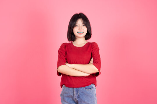 Asian Thai Student casual cute teen girl lovely portrait studio shot isolate on pink background.
