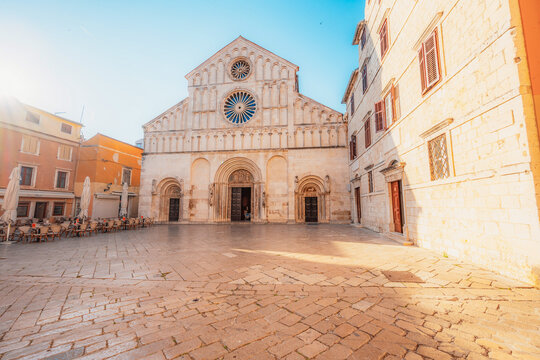 Zadar, Croatia. Old town street of Zadar with the Church of St. Donatus and the bell tower of the Cathedral of St. Anastasia at sunset.