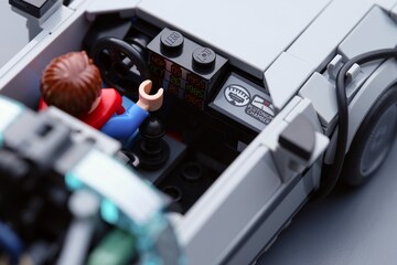 Fototapeta premium Tambov, Russian Federation - July 12, 2026 A close-up of a Lego Marty McFly minifigure sitting inside the DeLorean time machine car with visible time circuits. Back to the Future.