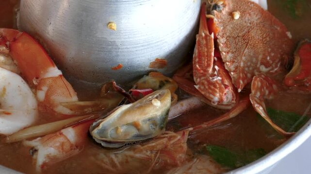 Seafood Spicy Tom Yum Soup in Hot Pot, Close Up