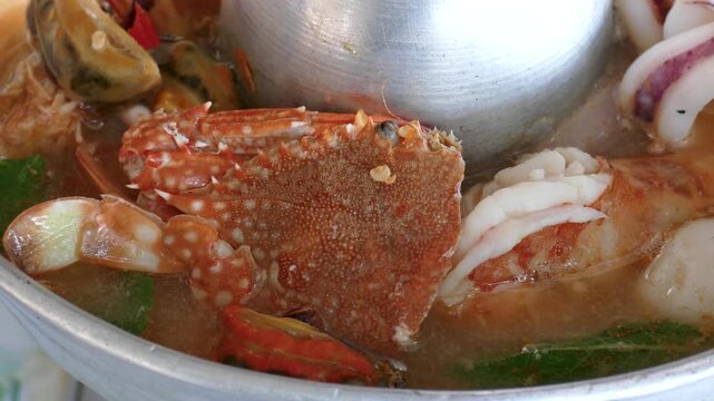Seafood Spicy Tom Yum Soup in Hot Pot, Close Up