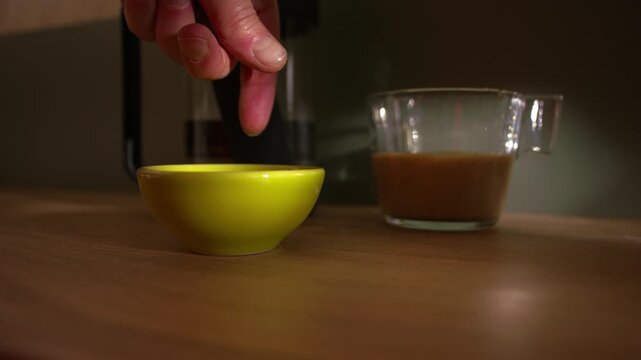 Hand leaves cash tips for service in bowl medium slow motion 4k shot selective focus