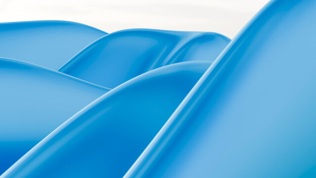 Curved blue plastic playground slides in outdoor setting