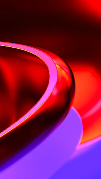 Abstract glossy curved red and purple reflective surface close-up