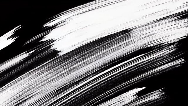 Abstract black and white brush strokes on a dark background.