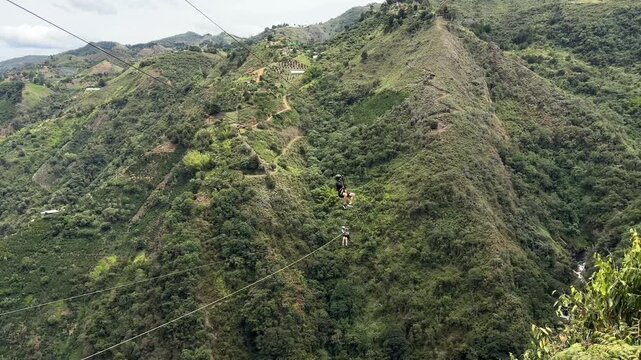Adrenaline zip line adventure over green mountain valley