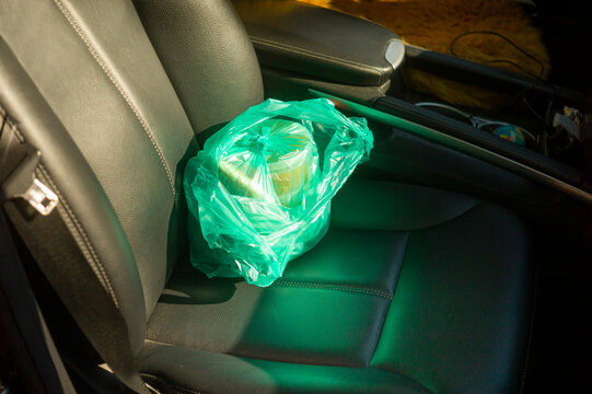 bag with food left on a car seat
