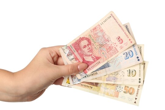 Female hand holding Bulgarian lev banknotes on white background