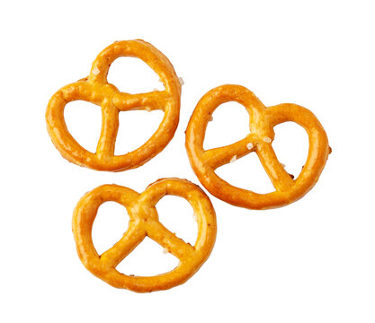 Three golden brown pretzels with salt crystals