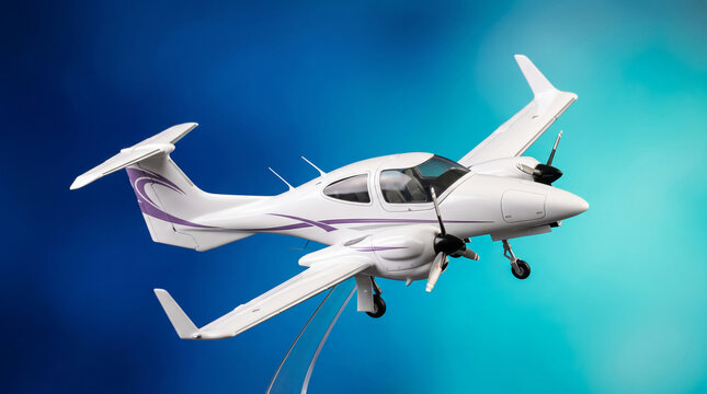 White twin-engine airplane model with purple accents, presented on a transparent stand against a blue gradient background, symbolizing aviation and travel